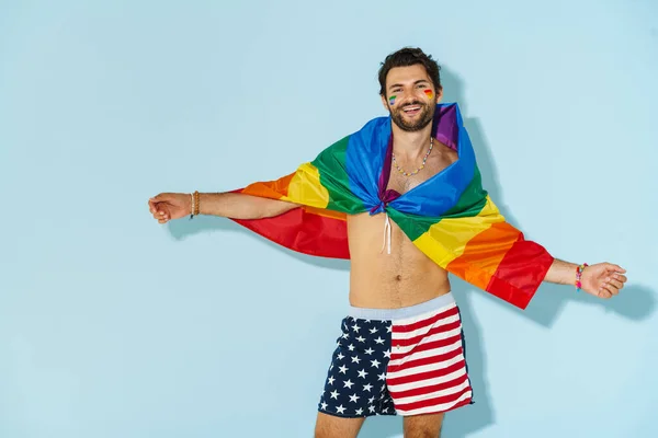 Shirtless Man Laughing While Posing Rainbow Flag Isolated Blue Wall — Stock Photo, Image