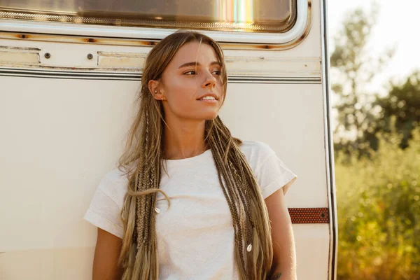 White Young Woman Pigtails Looking Aside While Leaning Trailer Outdoors — 스톡 사진
