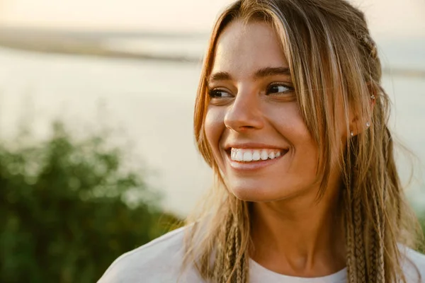 White Young Woman Pigtails Smiling Looking Aside Outdoors — Zdjęcie stockowe