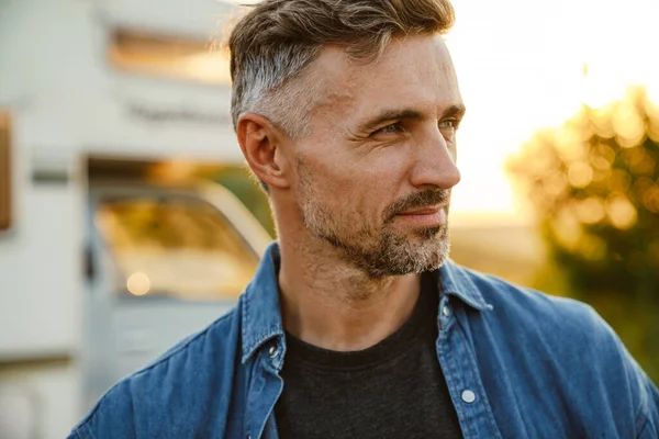 Grey European Man Smiling Looking Away While Standing Outdoors — Foto Stock