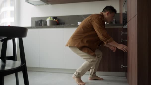 Confident Asian Man Wearing Casual Cloth Taking Things Out Washing — Stock Video