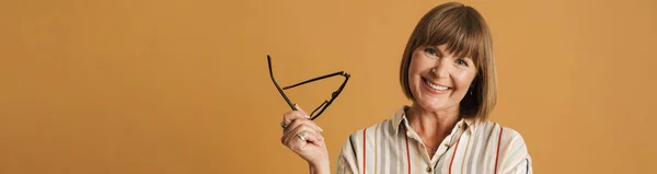 Senior Woman Smiling While Posing Wearing Eyeglasses Isolated Beige Wall — Photo