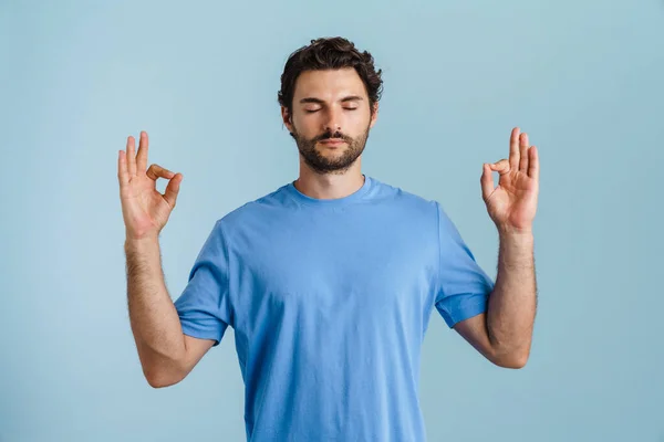 Young Brunette Man Bristle Gesturing While Meditating Isolated Blue Background — Foto Stock