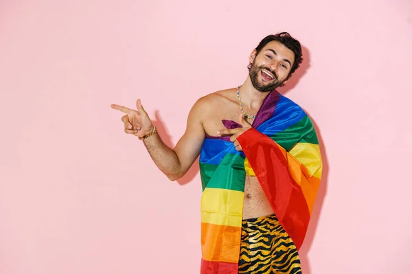 Young Shirtless Man Rainbow Flag Smiling While Pointing Fingers Aside — ストック写真