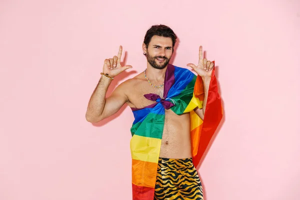 Young Shirtless Man Rainbow Flag Smiling While Pointing Fingers Upward — ストック写真