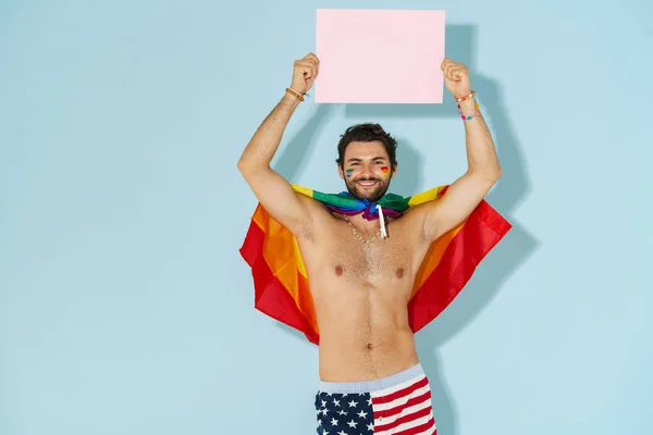 Hombre Joven Sin Camisa Con Bandera Arco Iris Sonriendo Mostrando —  Fotos de Stock