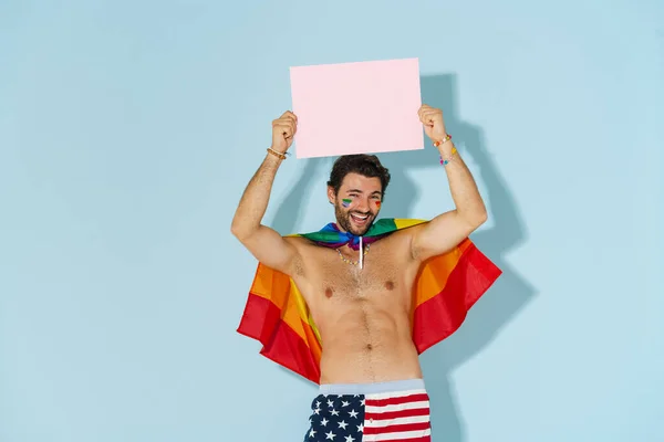 Joven Hombre Sin Camisa Con Bandera Del Arco Iris Riendo —  Fotos de Stock