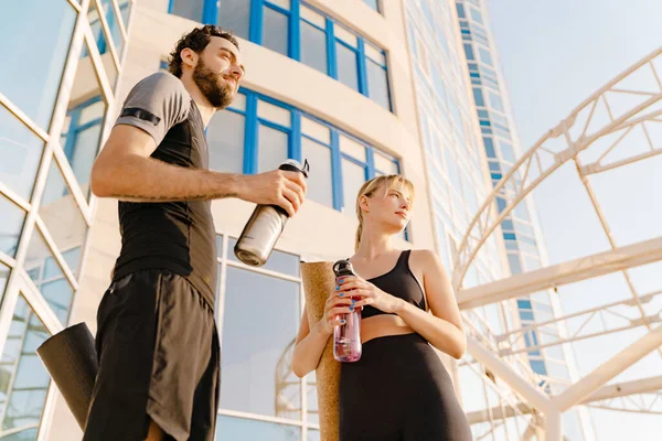 Young Man Woman Drinking Water While Working Out Together Outdoors — Stock Fotó