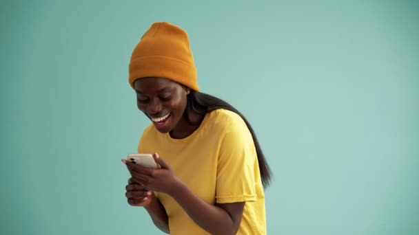 Joking African Woman Making Selfie Photo Phone Turquoise Studio — Stock Video