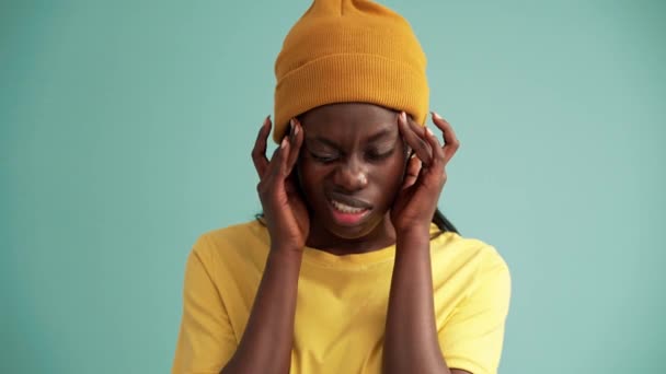 Sad African Woman Suffering Headache Turquoise Studio — Video