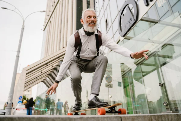 Grey Mature Man Beard Smiling While Skateboarding City Street — Foto Stock