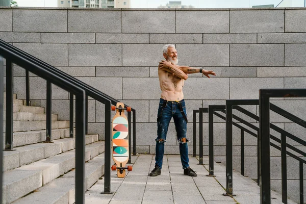 Shirtless Mature Man Doing Warmup While Standing Skateboard Stairs Outdoors — Stock Photo, Image