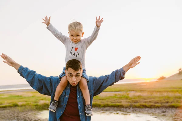 Young White Father Son Gesturing Grimacing Together Outdoors — Stock Photo, Image
