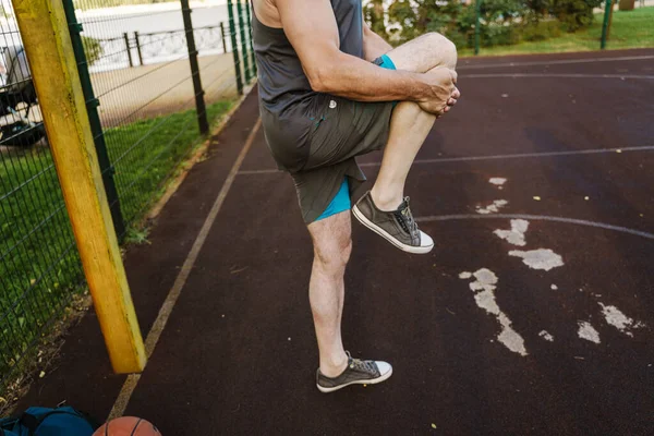 White Senior Man Stretching His Leg While Working Out Playground — Foto Stock