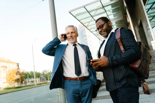 Multiracial Men Using Mobile Phones While Standing Building Outdoors — Foto Stock