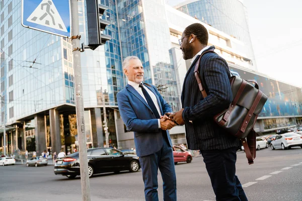 Multiracial Men Smiling Handshaking While Standing City Street — Foto Stock