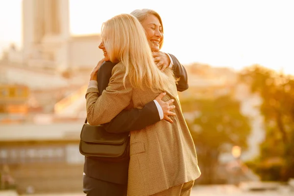 Mature Multiracial Businesswomen Laughing Hugging Meeting Outdoors — Stockfoto