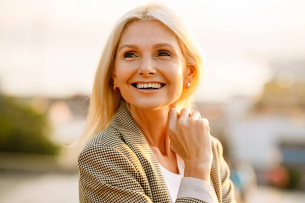 Mature White Businesswoman Wearing Suit Smiling Looking Aside Outdoors — Fotografia de Stock