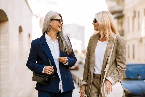 Mature Multiracial Women Smiling Talking While Walking City Street — Fotografia de Stock