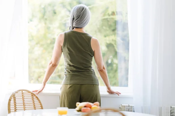 Mature Asian Woman Grey Hair Looking Out Window Morning Home — Foto Stock