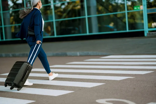 Grey Woman Face Mask Walking Suitcase Zebra Crossing Outdoors — стоковое фото