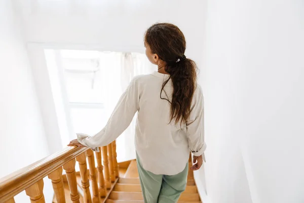 Young Black Woman Wearing Pajama Walking Downstairs Home — Photo
