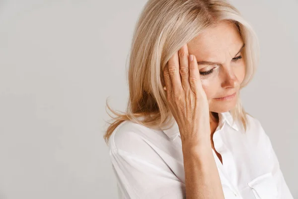 Mature Blonde Woman Headache Holding Her Head Isolated White Background — стоковое фото