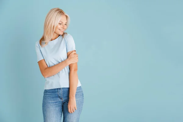 Mature Blonde Woman Wearing Shirt Smiling Looking Aside Isolated Blue — Stock Photo, Image