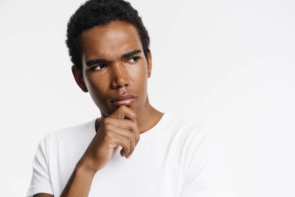 Young Black Man Looking Aside While Holding His Chin Isolated — Stock Photo, Image