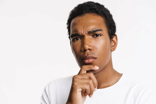 Young Black Man Looking Camera Frowning While Holding His Chin —  Fotos de Stock