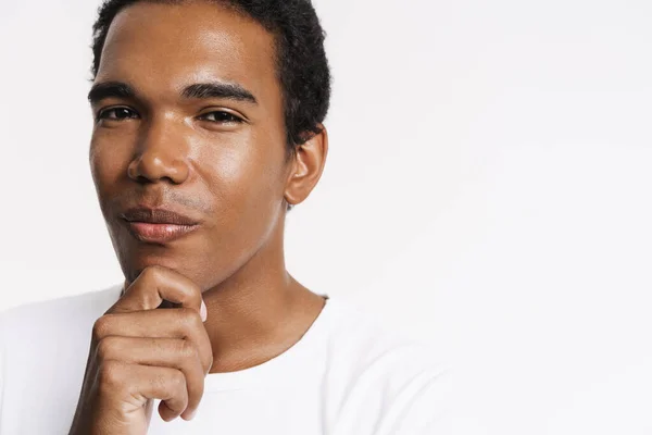 Young Black Man Looking Camera While Holding His Chin Isolated — Foto de Stock