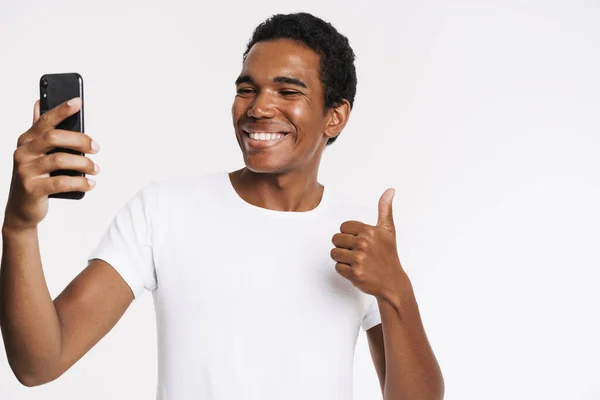 Young Black Man Gesturing While Taking Selfie Cellphone Isolated White — Stock Fotó