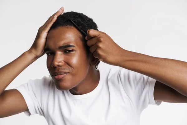 Young Black Man Smiling Camera While Combing His Hair Isolated — Stock Photo, Image