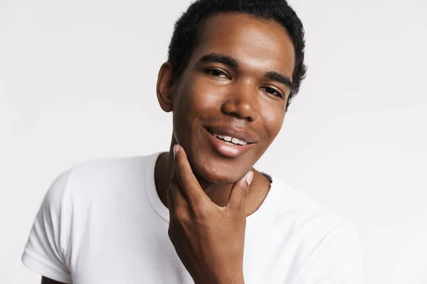 Young Black Man Laughing Camera While Touching His Skin Isolated — Stockfoto
