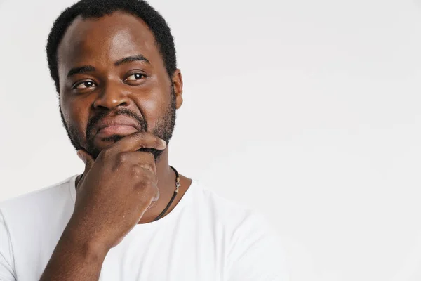 Black Bristle Man Grimacing While Holding His Chin Isolated White — Foto de Stock