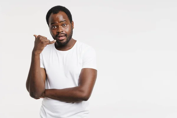 Black Man Expressing Surprise While Showing Handset Gesture Isolated White — Foto de Stock