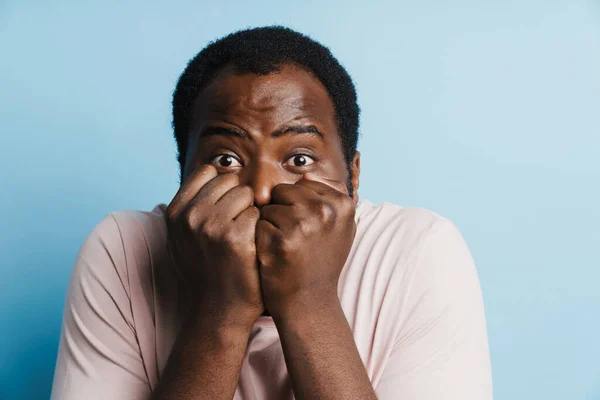 Black Scared Man Shirt Posing Clenched Fists Isolated Blue Background — 스톡 사진