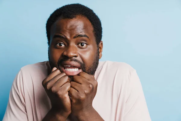 Black Scared Man Grimacing While Posing Clenched Fists Isolated Blue — Stockfoto