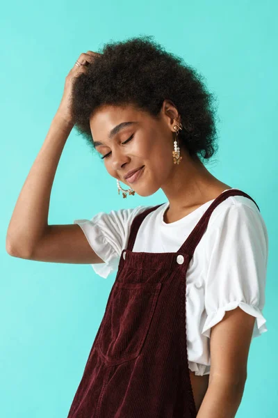 Black Young Woman Earrings Smiling While Posing Camera Isolated Blue — 스톡 사진