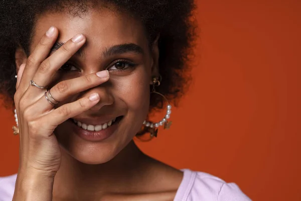 Young Black Woman Wearing Earrings Smiling Covering Her Face Isolated — Stock fotografie