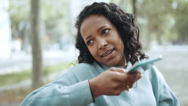 Cheerful Brunette African Woman Wearing Blue Sweater Recording Voice Message — Stock video