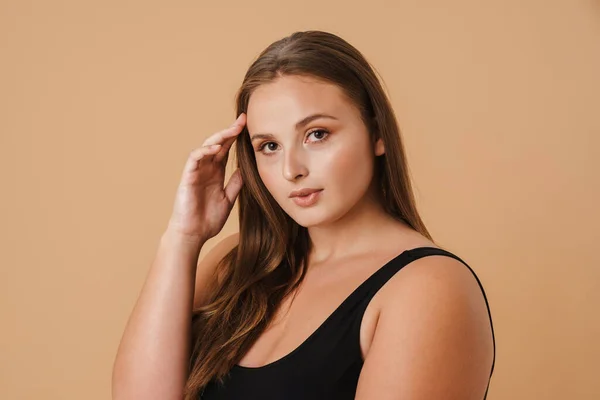 Young Woman Wearing Swimsuit Posing Looking Camera Isolated Beige Background — Stockfoto
