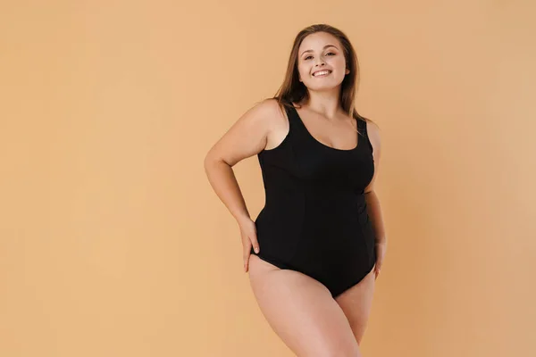 Young Woman Wearing Swimsuit Smiling Looking Camera Isolated Beige Wall — 스톡 사진