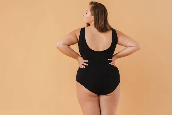 Young White Woman Wearing Swimsuit Posing Camera Isolated Beige Background — 스톡 사진