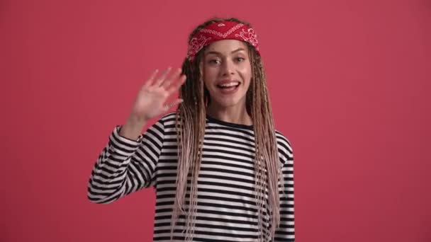 Happy Hippie Woman Doing Hello Gesture Camera Pink Studio — Stockvideo