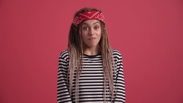Confused Hippie Woman Looking Pink Studio — Stok video