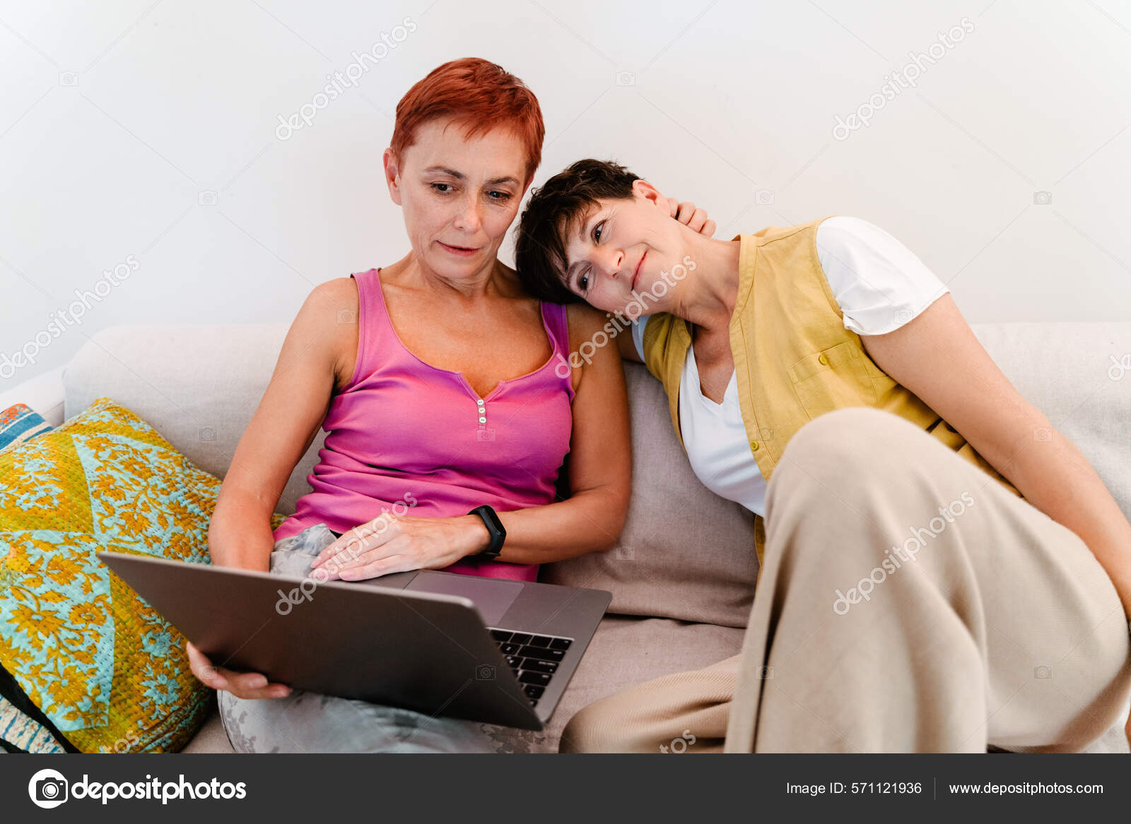 Mature Lesbian Couple Using Laptop While Resting Sofa Together Home Stock  Photo by ©Vadymvdrobot 571121936