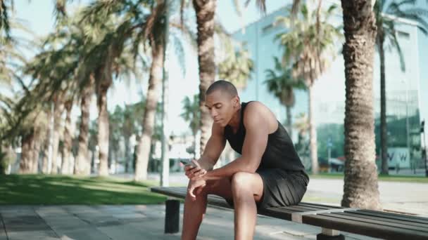 Bald Positive Sportsman Wearing Black Shirt Typing Phone Bench Morning — Stock Video