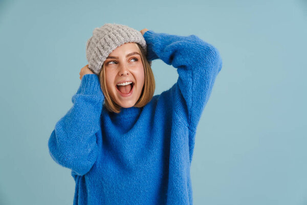 Young Blonde Woman Wearing Knit Hat Smiling Winking Camera Isolated Stock Photo