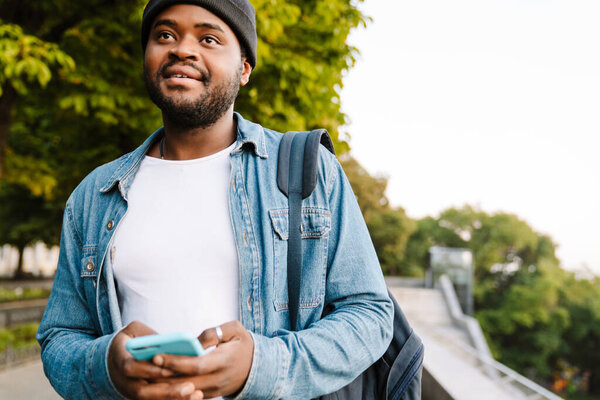 Black Young Man Using Mobile Phone While Walking Summer Park Stock Image